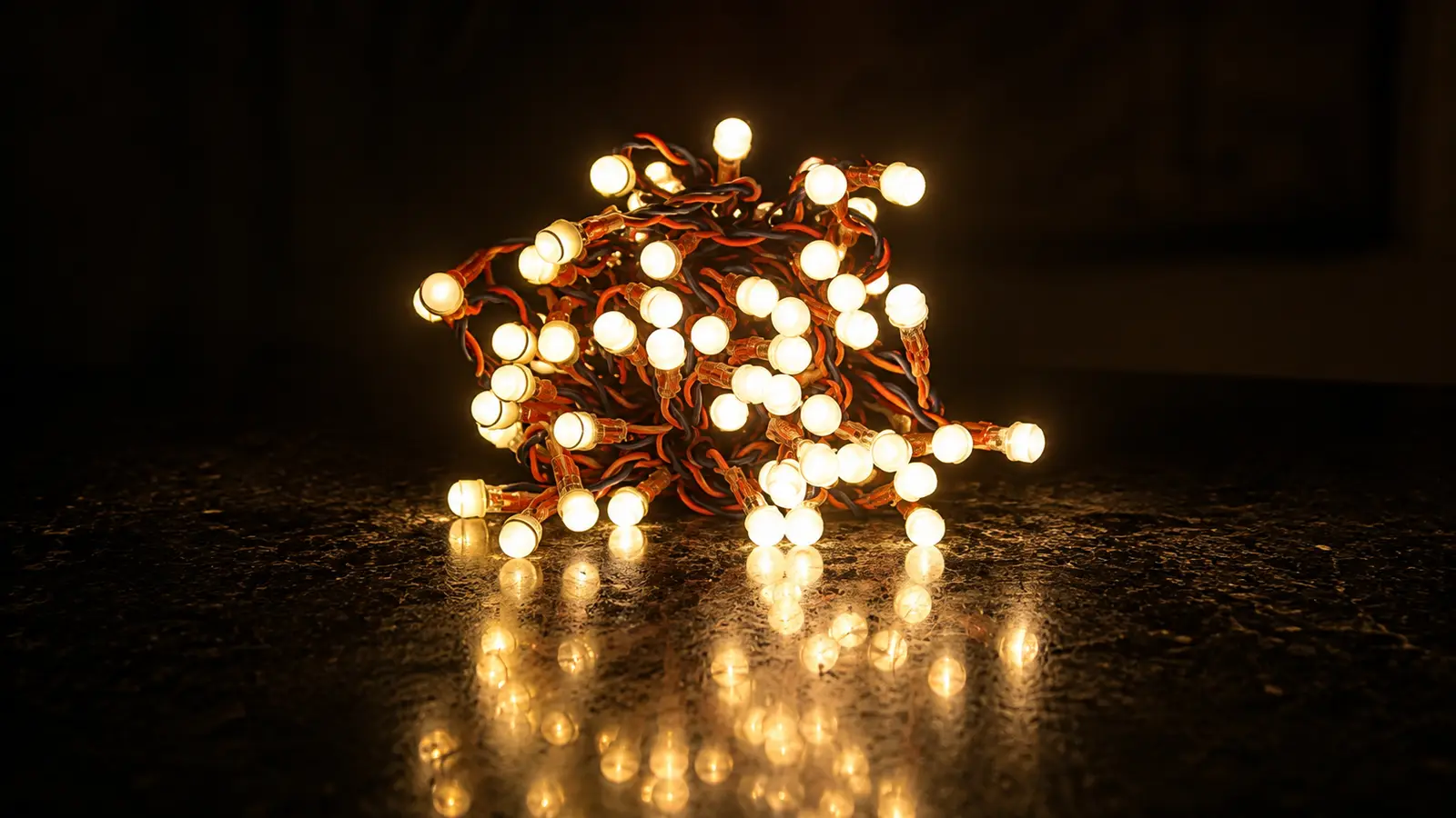 Pixel LED series light lit in warm white, showing the dense spacing of the LEDs along the wire
